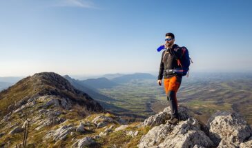 Man wearing hiking gear prepared for outdoor adventure