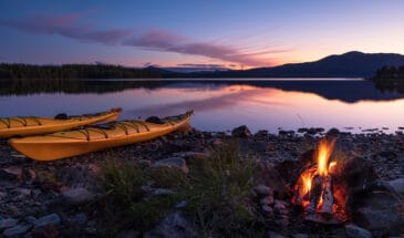 Campfire,During,Dusk,At,The,Shore,Of,A,Lake,With